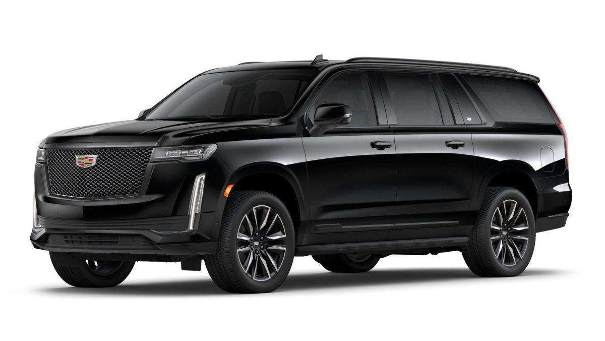 A black Cadillac Escalade SUV viewed from the front left side, showing its large grille, chrome accents, and prominent headlights.