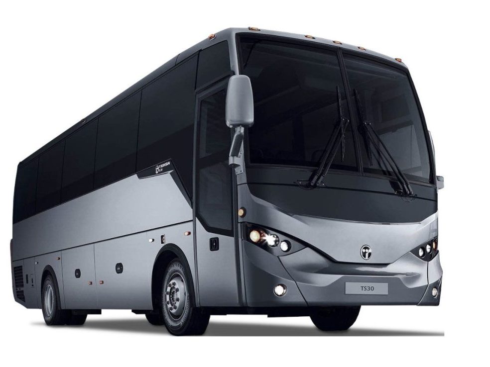 A silver and black coach bus with tinted windows is parked on a white background, viewed from the front left side.